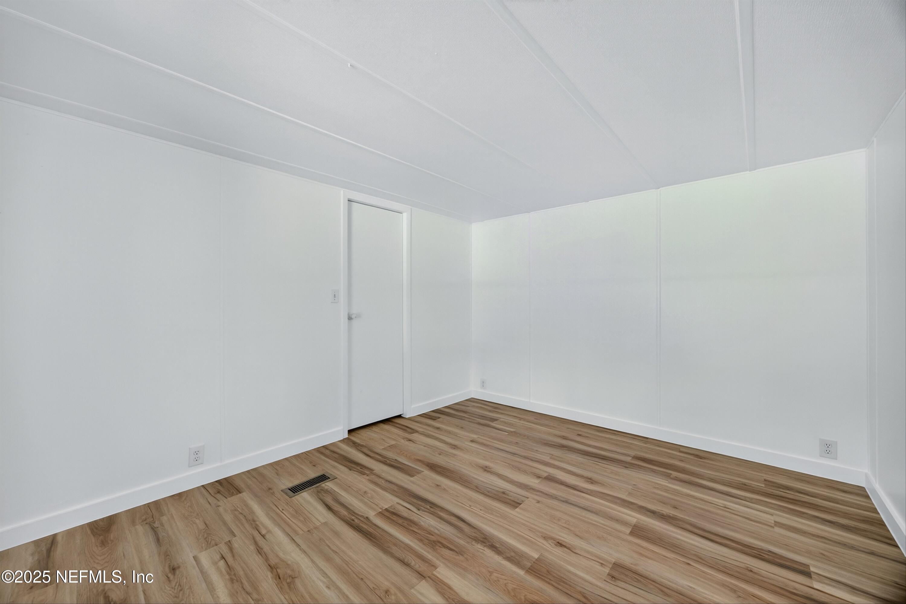 349 Stokes Landing Road St. Augustine, FL 32095 - Photo 13 of 45 a view of room with wooden floor