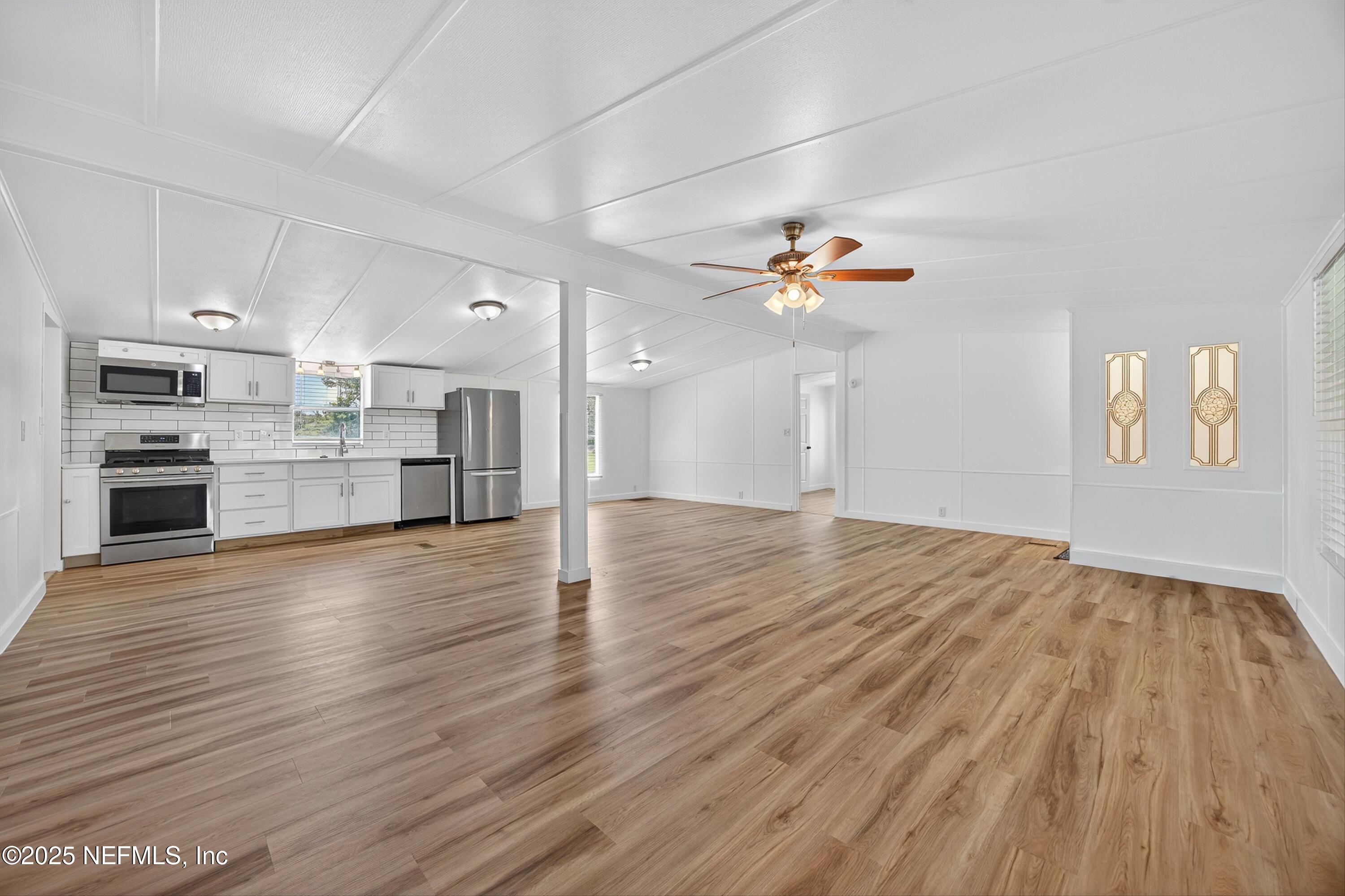 349 Stokes Landing Road St. Augustine, FL 32095 - Photo 15 of 45 a view of a kitchen with wooden floor and a kitchen space