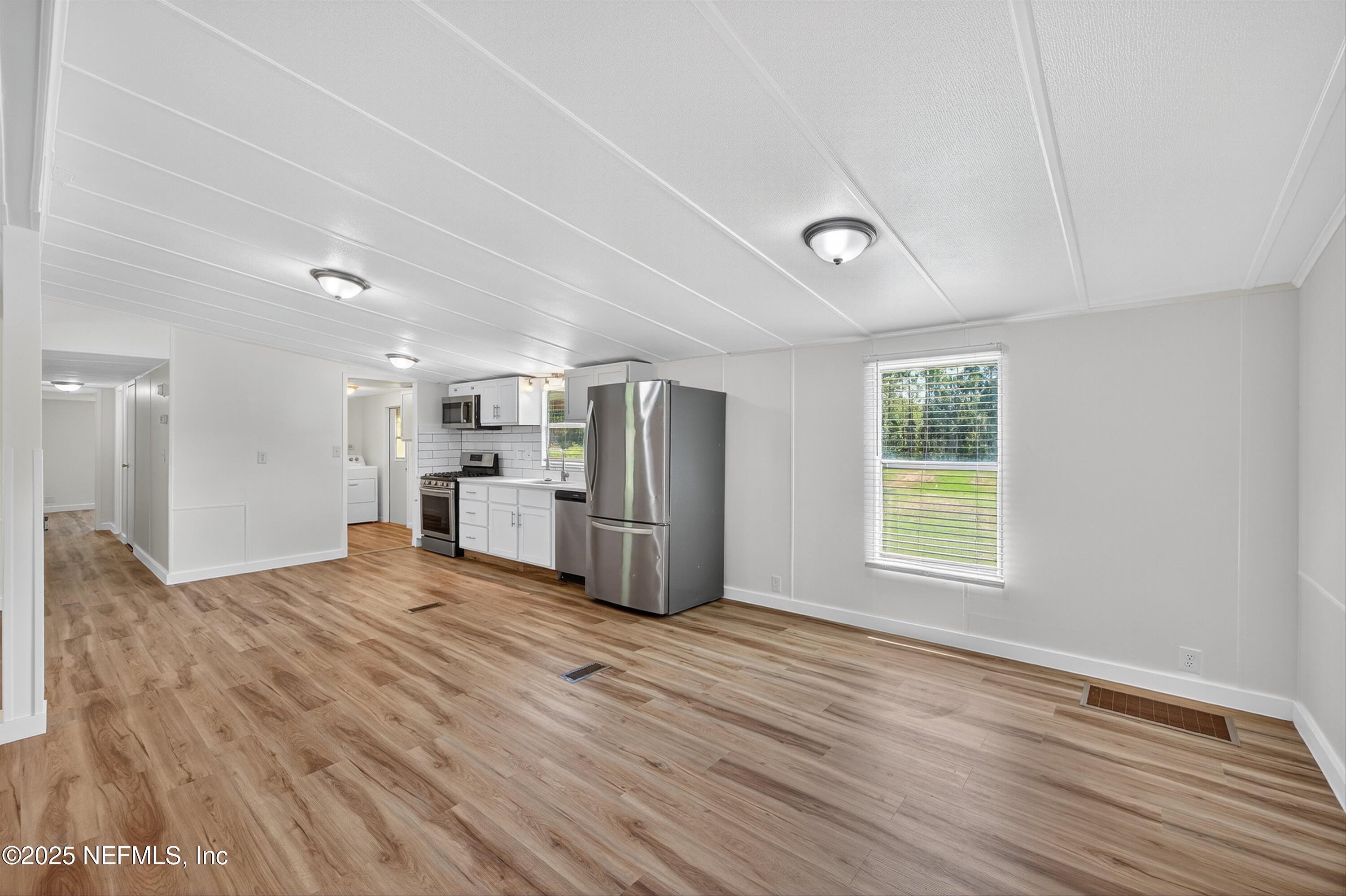 349 Stokes Landing Road St. Augustine, FL 32095 - Photo 19 of 45 a view of a kitchen with a sink and a window