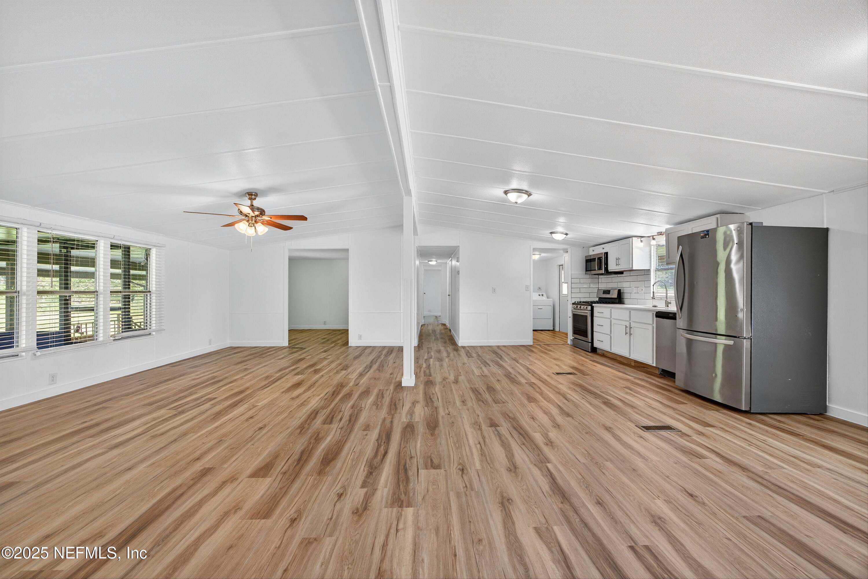 349 Stokes Landing Road St. Augustine, FL 32095 - Photo 20 of 45 a view of kitchen with furniture and wooden floor