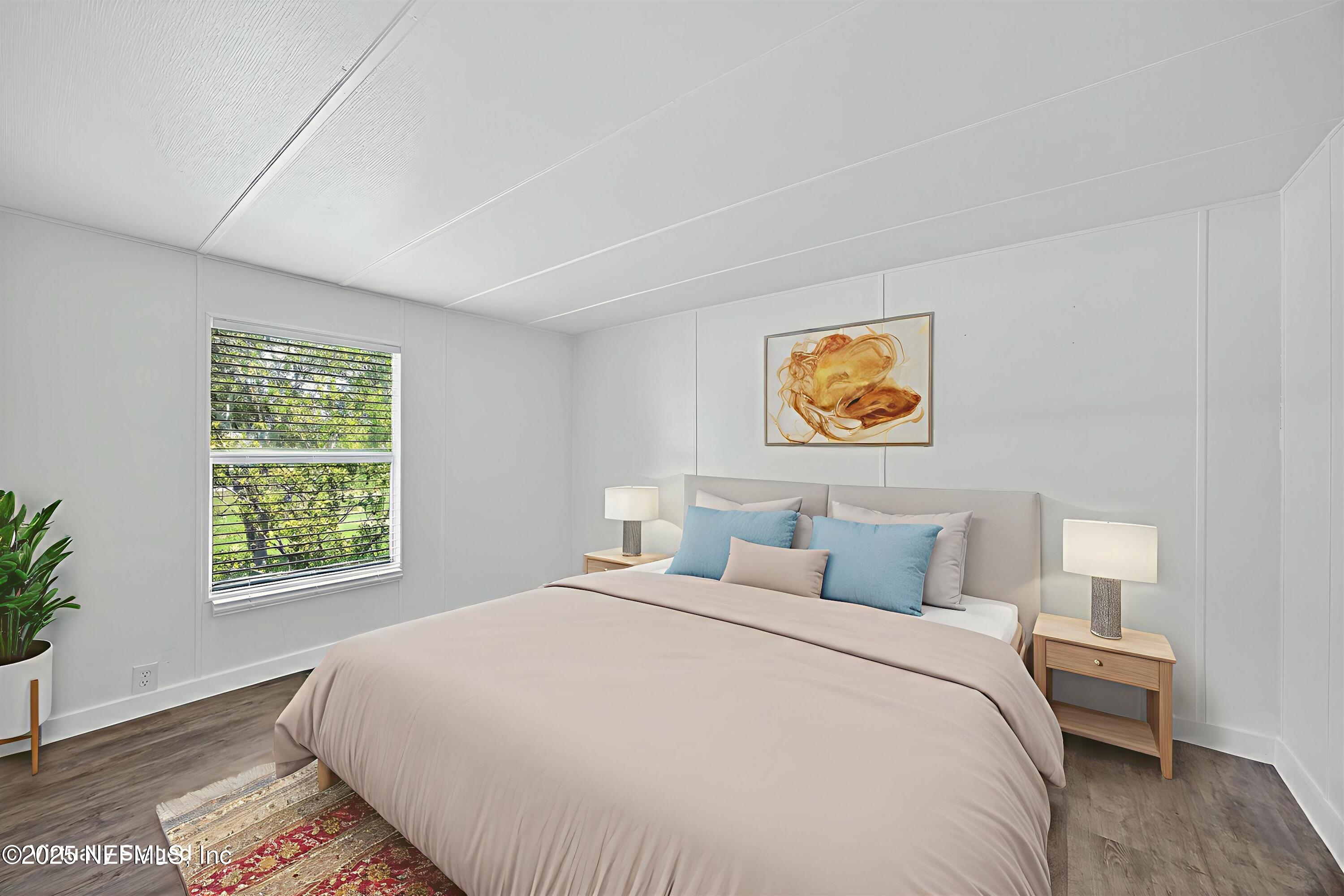 349 Stokes Landing Road St. Augustine, FL 32095 - Photo 25 of 45 a bedroom with a bed and a window