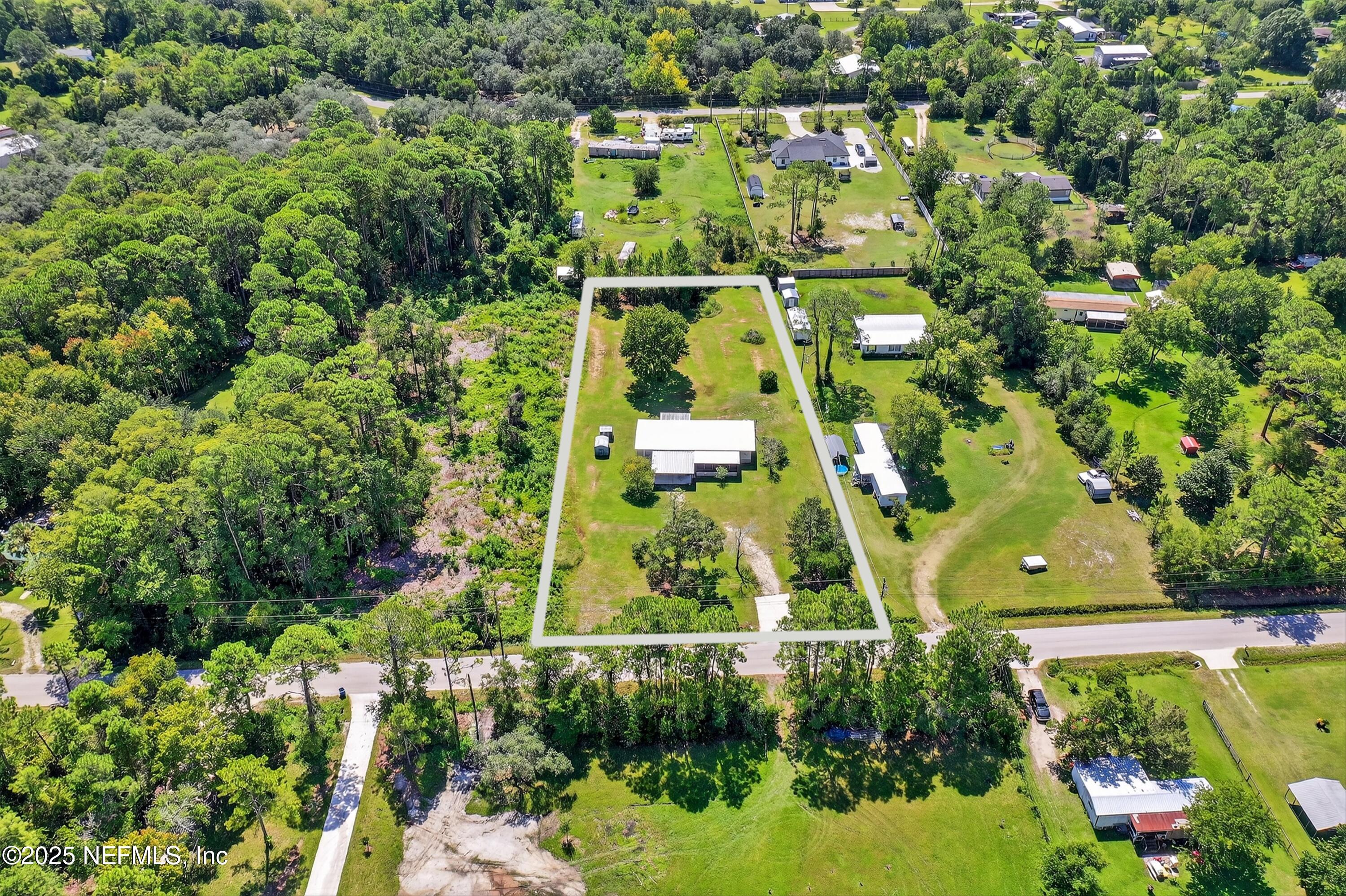 349 Stokes Landing Road St. Augustine, FL 32095 - Photo 3 of 45 an aerial view of multiple houses with yard