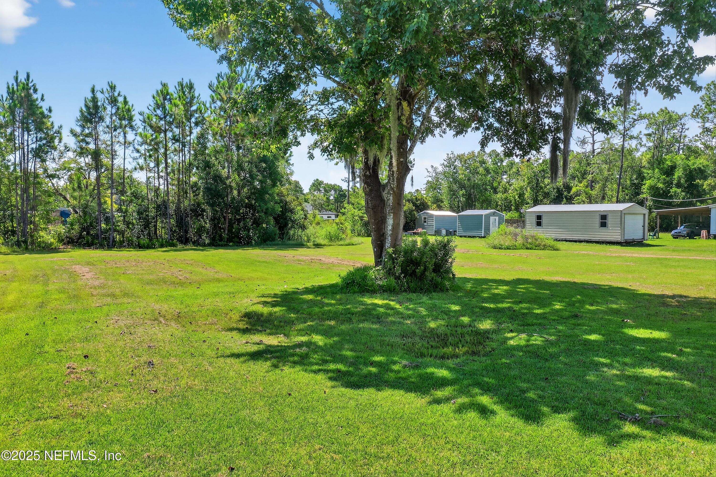 349 Stokes Landing Road St. Augustine, FL 32095 - Photo 39 of 45 a view of a house with a backyard