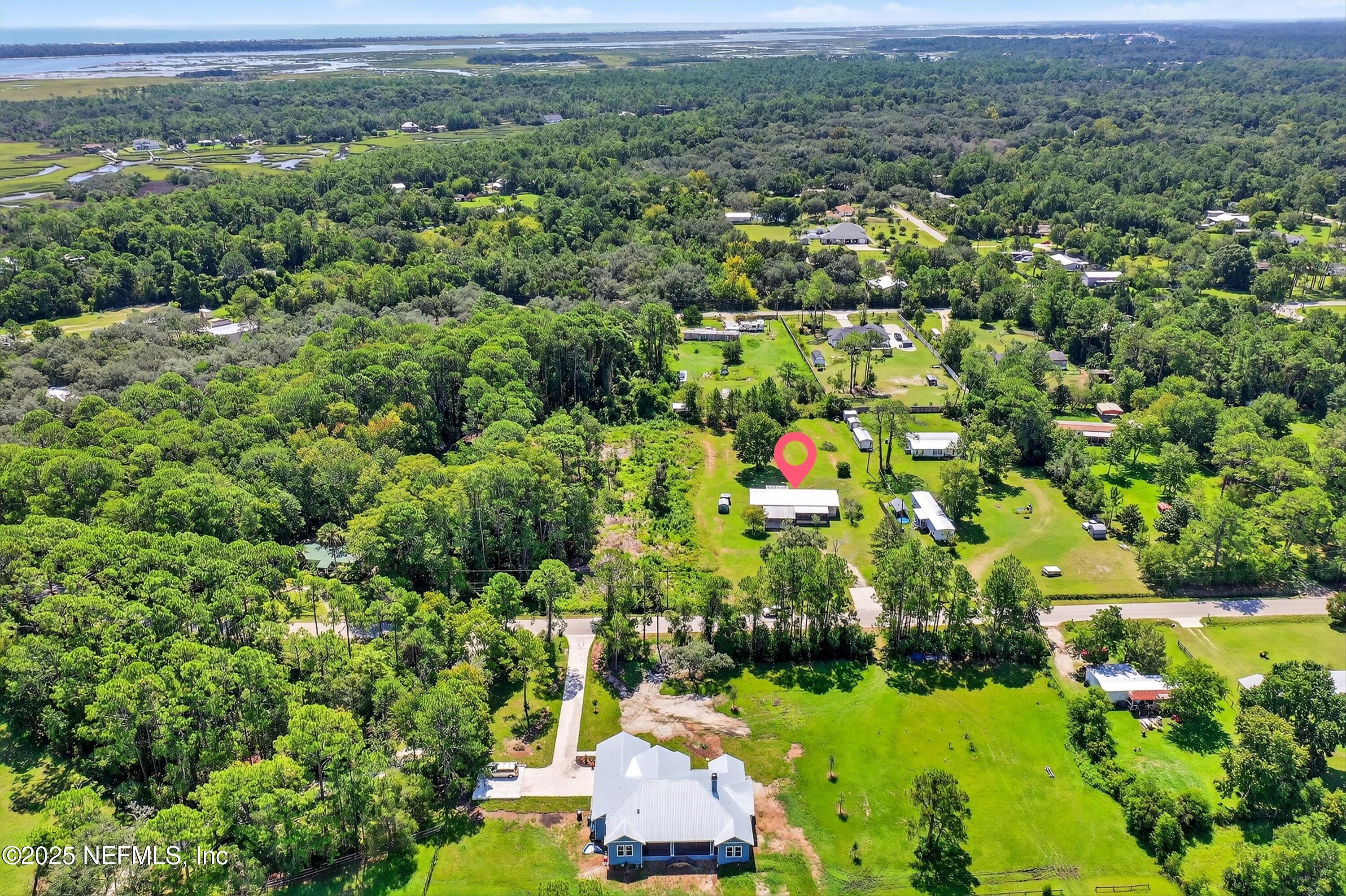 349 Stokes Landing Road St. Augustine, FL 32095 - Photo 40 of 45 an aerial view of a houses with a yard