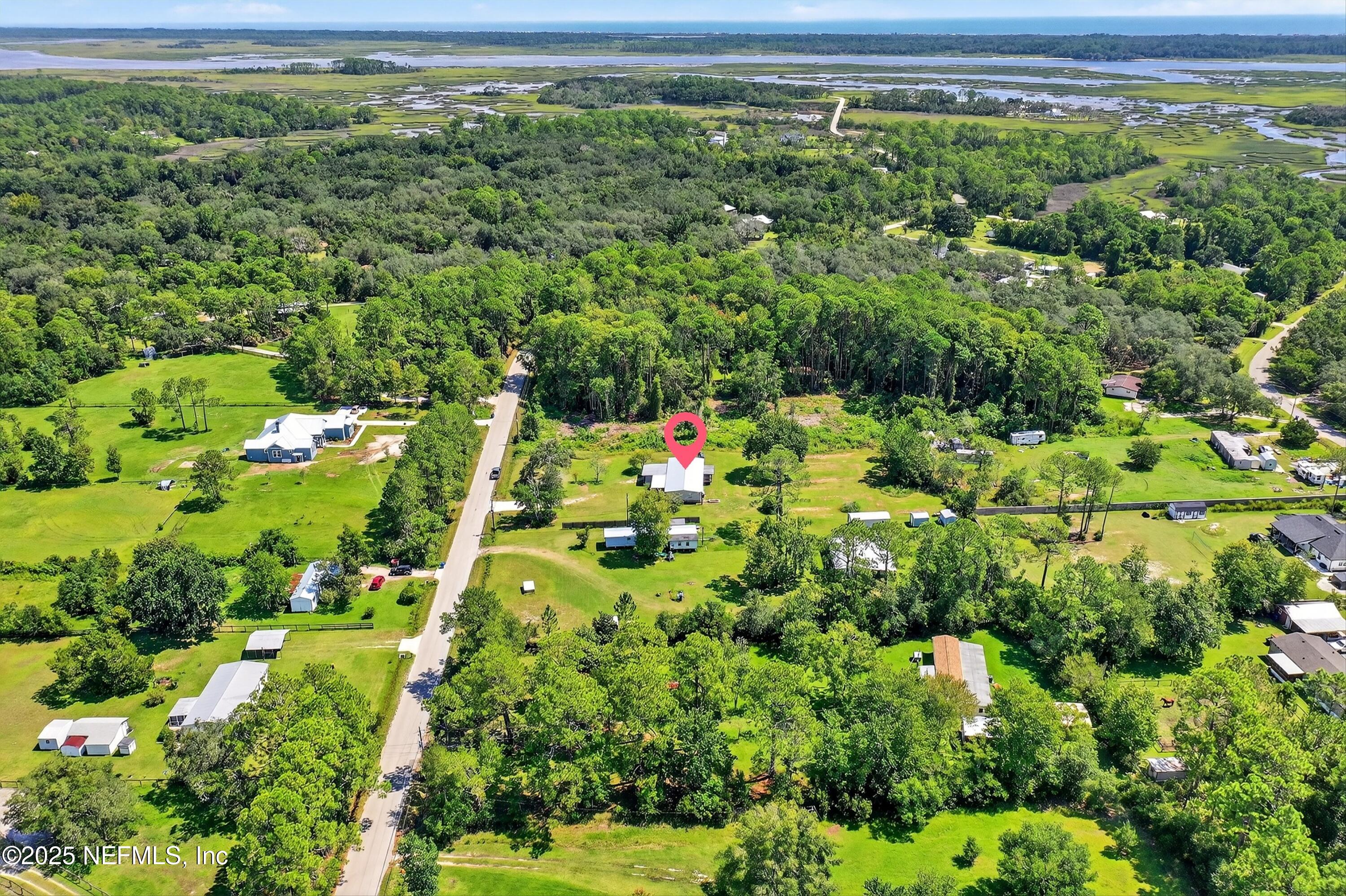 349 Stokes Landing Road St. Augustine, FL 32095 - Photo 43 of 45 a view of a garden with a building