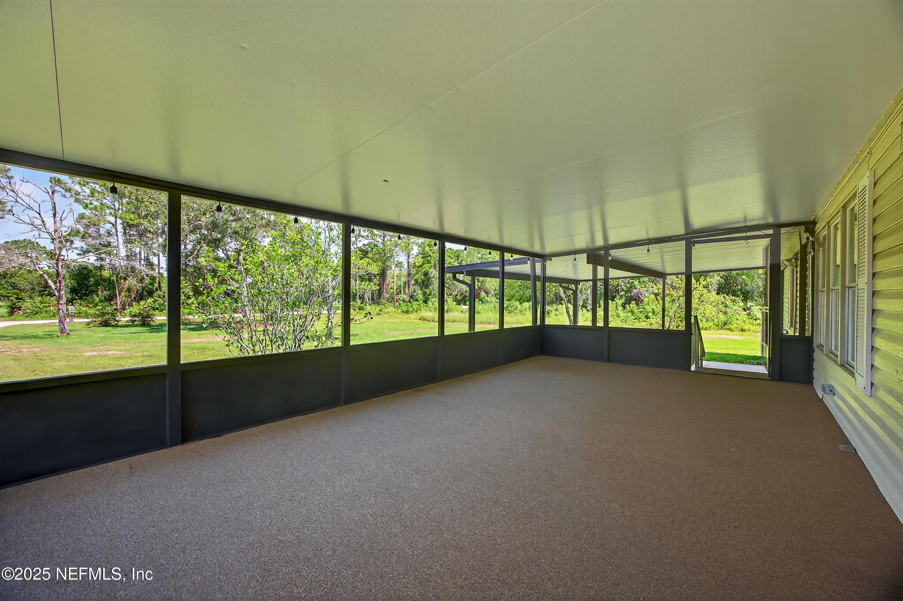 349 Stokes Landing Road St. Augustine, FL 32095 - Photo 6 of 45 a view of an empty room with a large window