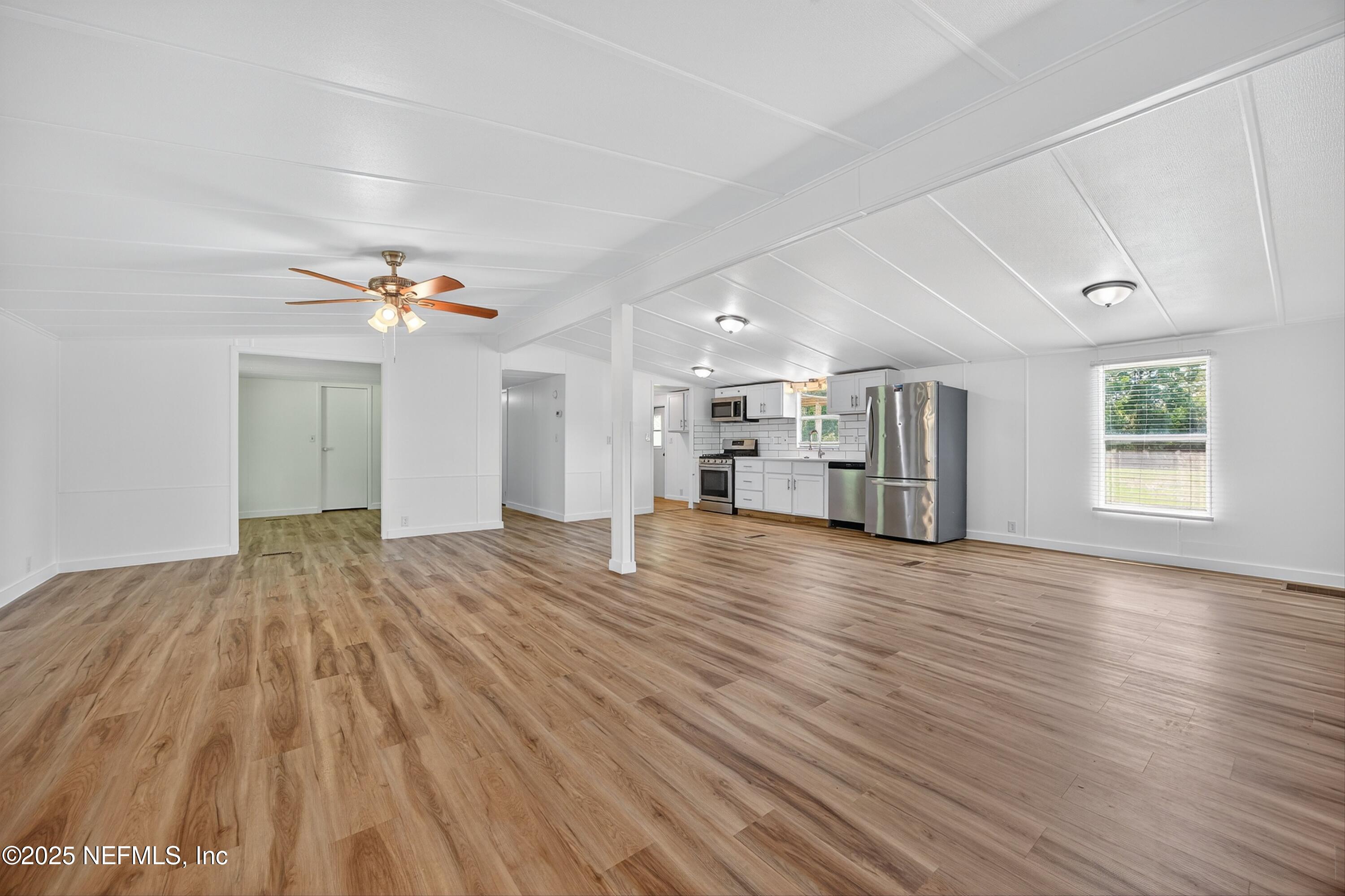 349 Stokes Landing Road St. Augustine, FL 32095 - Photo 9 of 45 a view of empty room with wooden floor