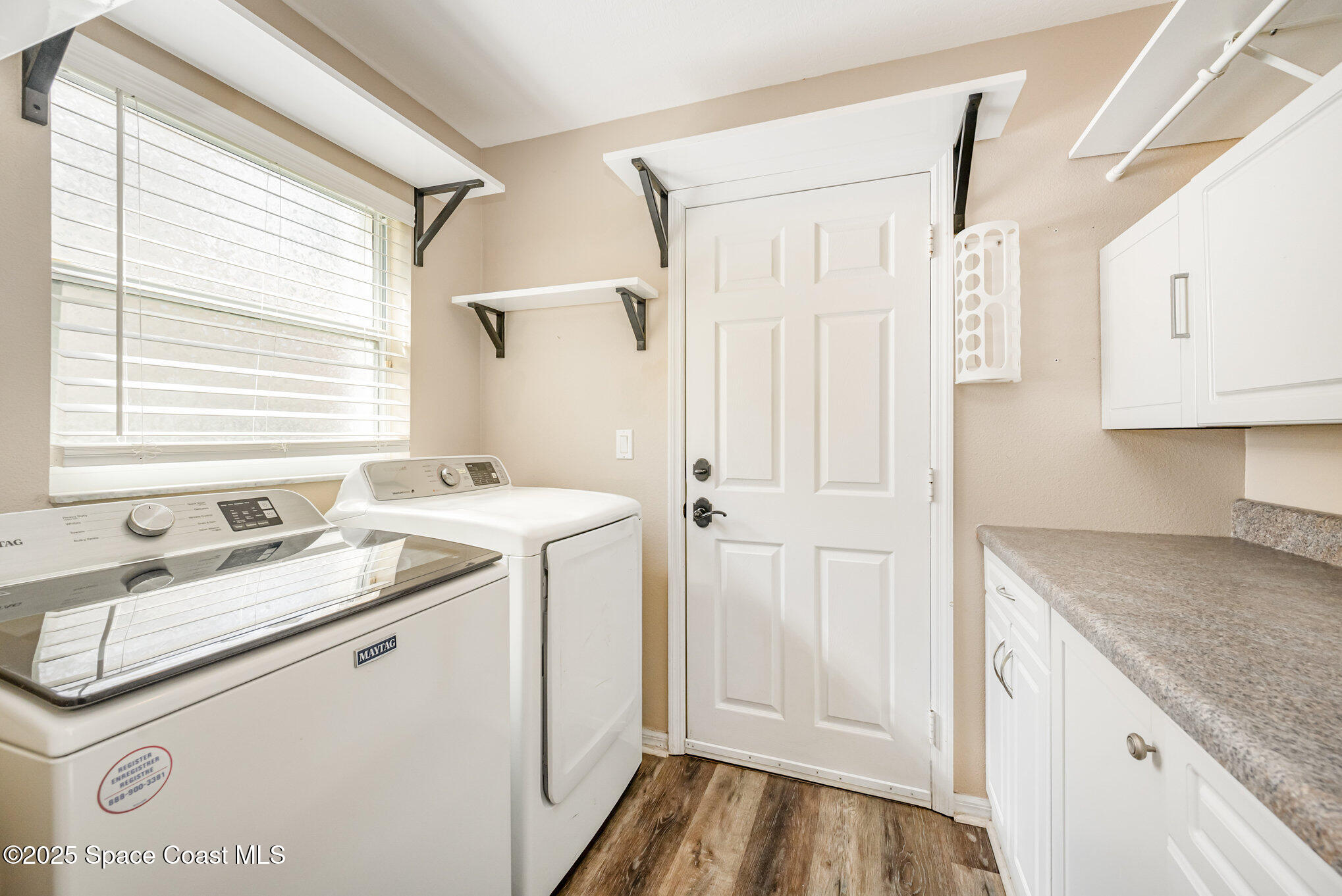 968 Wimbledon Drive Melbourne, FL 32940 - Photo 16 of 47 a bathroom with a granite countertop sink and a mirror