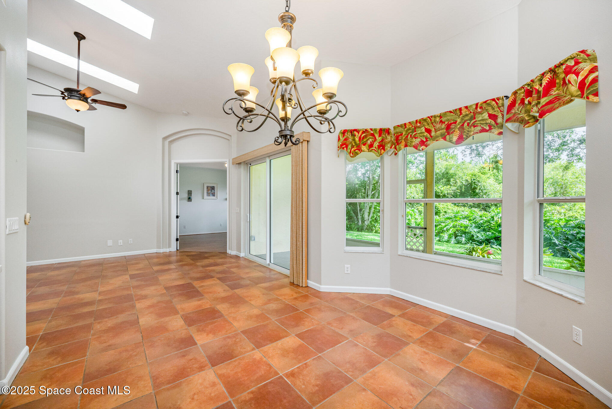 968 Wimbledon Drive Melbourne, FL 32940 - Photo 17 of 47 a view of a livingroom with a chandelier fan and window
