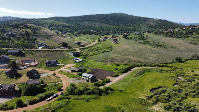 an aerial view of residential house with outdoor space