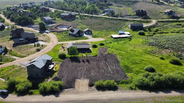 an aerial view of a house with outdoor space
