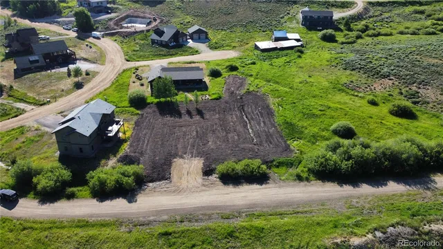 an aerial view of house with yard