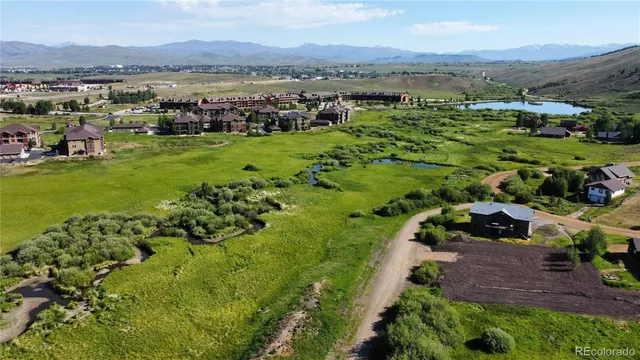 a view of a city with mountains in the background