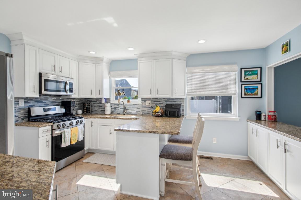 9 Midwood Road Marlton, NJ 08053 - Photo 8 of 26 a kitchen with white cabinets and appliances