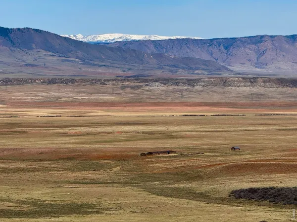 a view of a house with a mountain