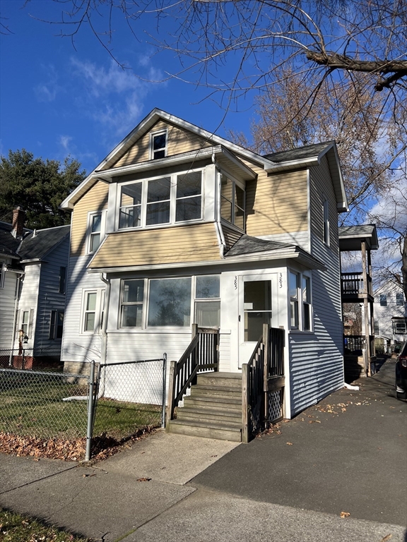 383 Newbury Street, Unit 2 Springfield, MA 01104 - Photo 1 of 11 a front view of a house with a yard
