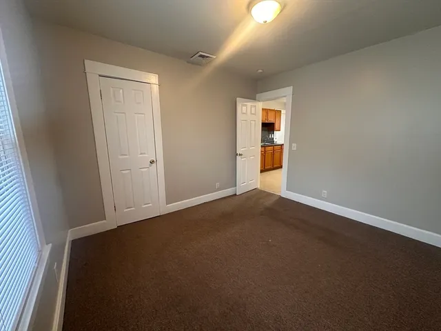 an empty room with window