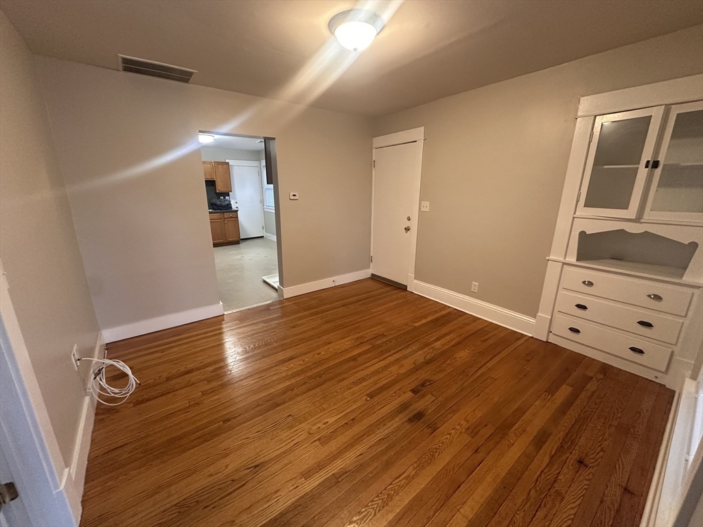 383 Newbury Street, Unit 2 Springfield, MA 01104 - Photo 6 of 11 wooden floor in an empty room