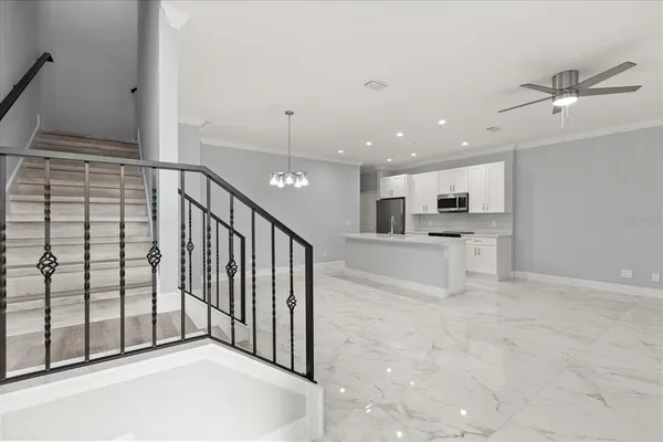 a view of a kitchen with a sink and cabinets