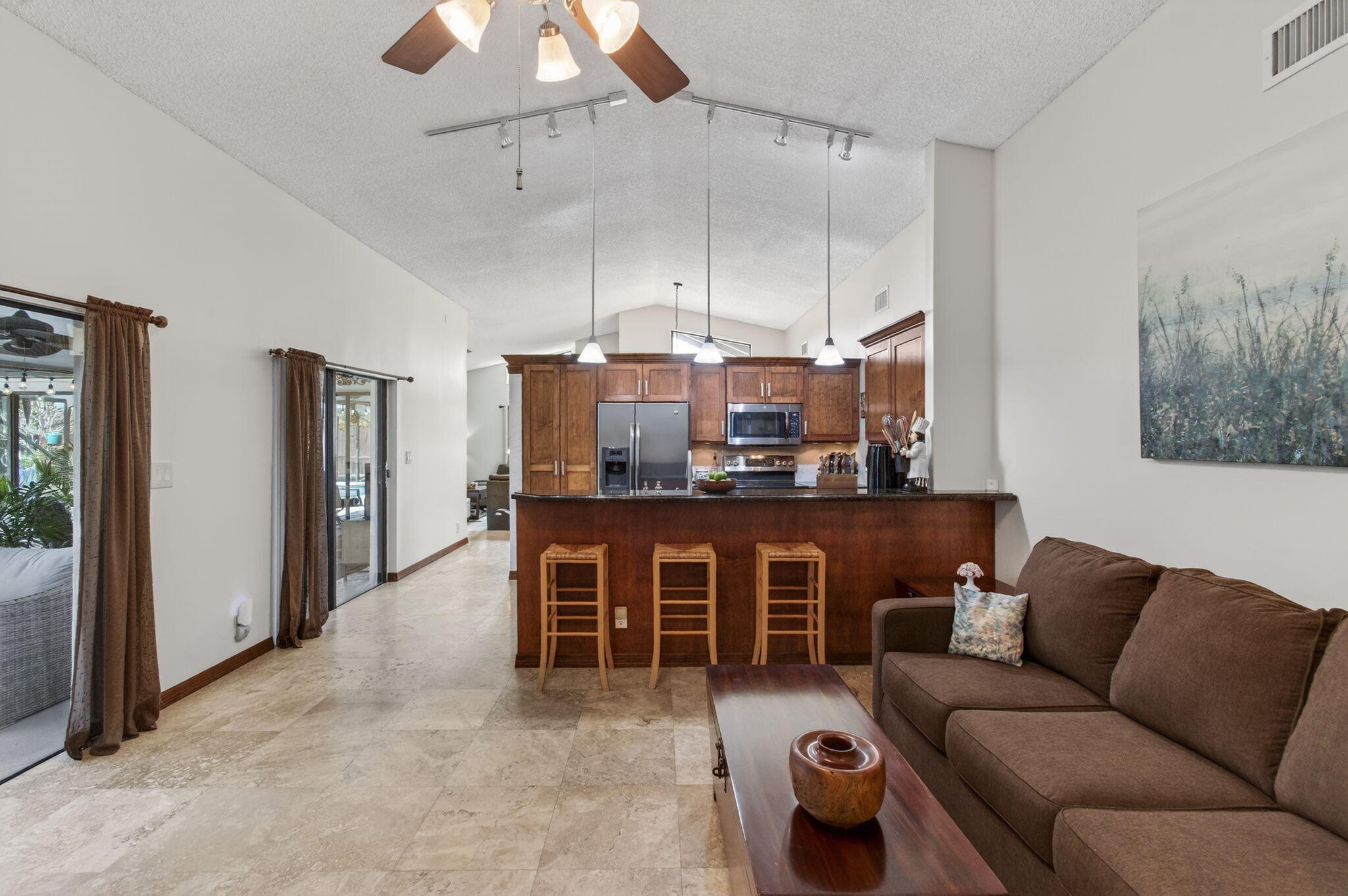 11457 Country Sound Court Boca Raton, FL 33428 - Photo 23 of 112 a living room with furniture a chandelier and a dining table