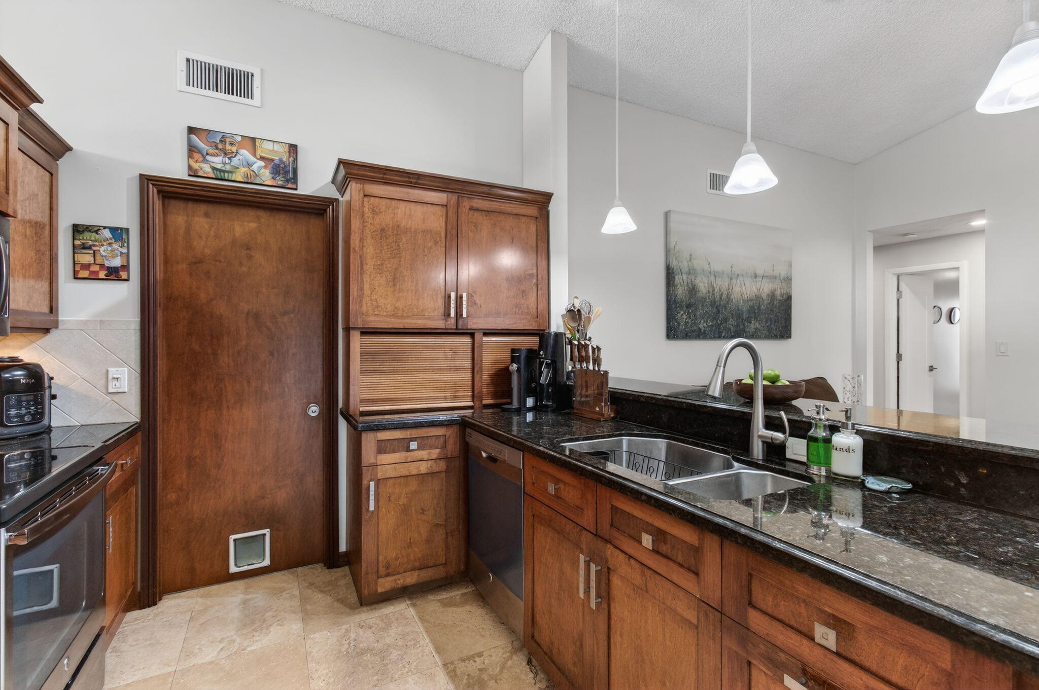11457 Country Sound Court Boca Raton, FL 33428 - Photo 29 of 112 a modern kitchen with stainless steel appliances granite countertop a sink refrigerator and cabinets