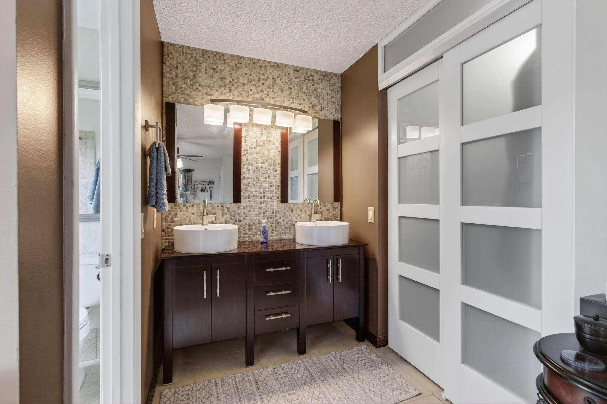 11457 Country Sound Court Boca Raton, FL 33428 - Photo 55 of 112 a bathroom with a double vanity sink and a mirror