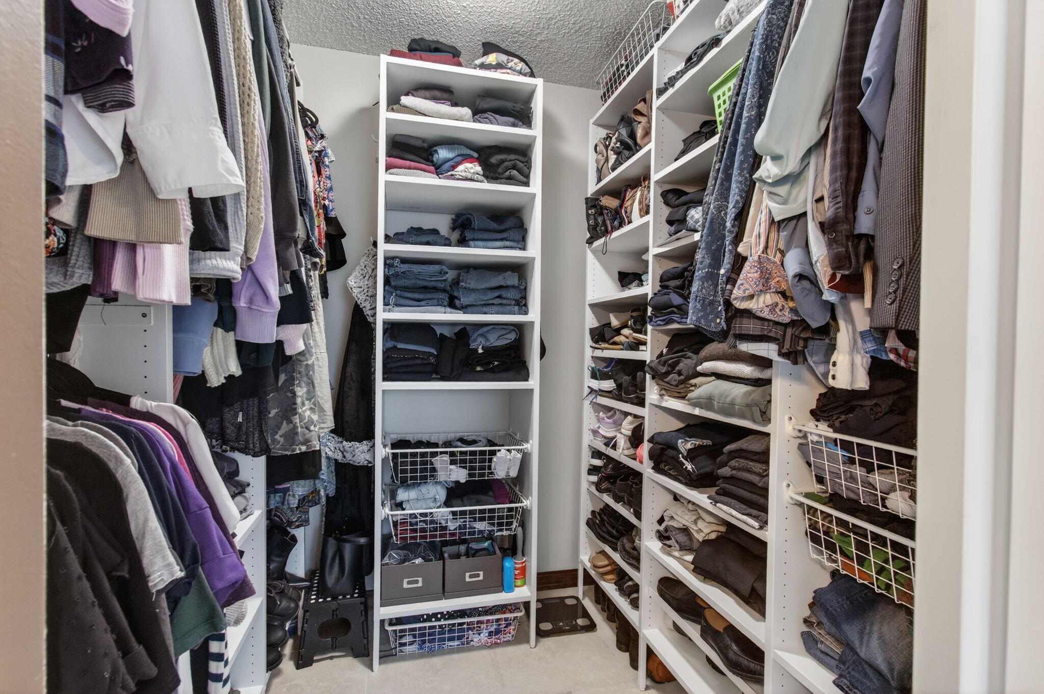 11457 Country Sound Court Boca Raton, FL 33428 - Photo 57 of 112 a view of walk in closet with clothes and shoes