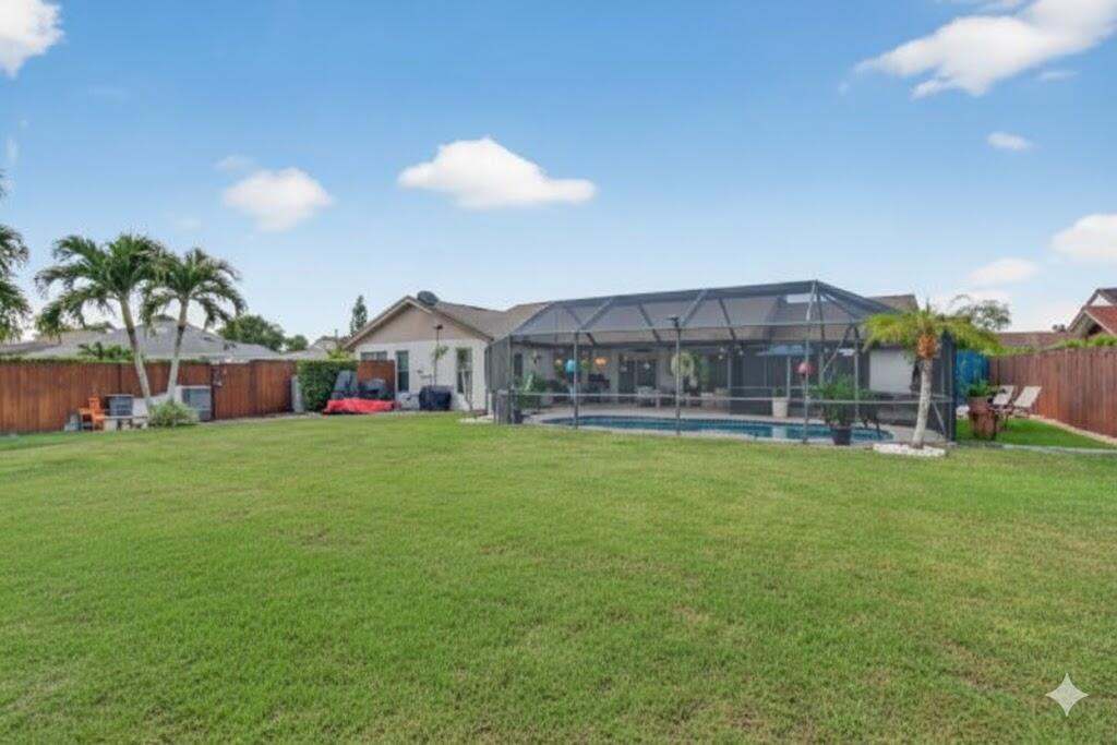 11457 Country Sound Court Boca Raton, FL 33428 - Photo 82 of 112 a front view of house with yard and seating area