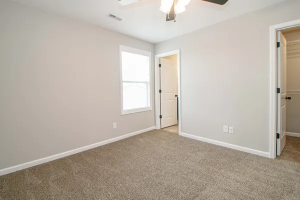 an empty room with a empty space and a window