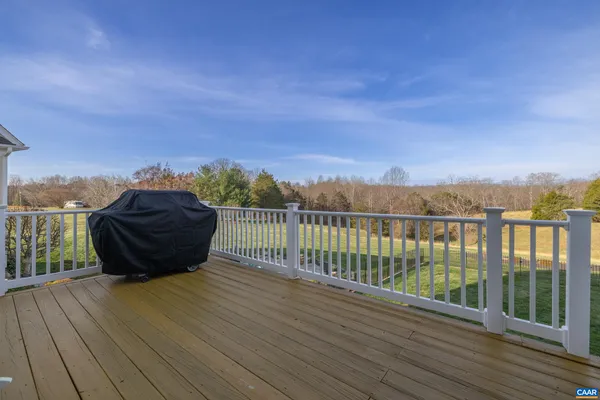 an aerial view of a house with a swimming pool