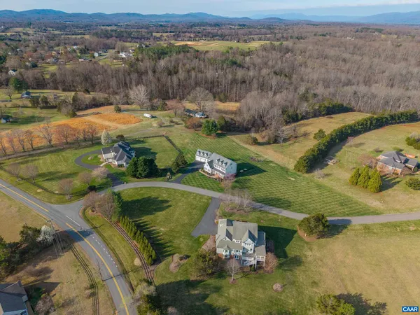 a bathroom with a sink toilet and mirror