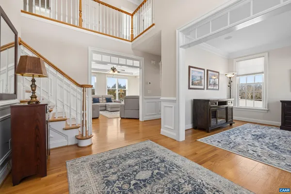a kitchen with stainless steel appliances granite countertop a stove and a view of kitchen island