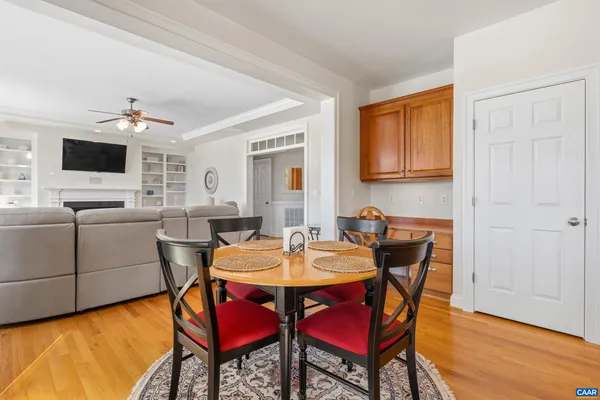 a bedroom with a bed and a flat tv screen on dresser