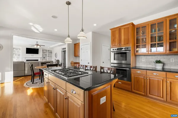 a bathroom with a granite countertop sink mirror and