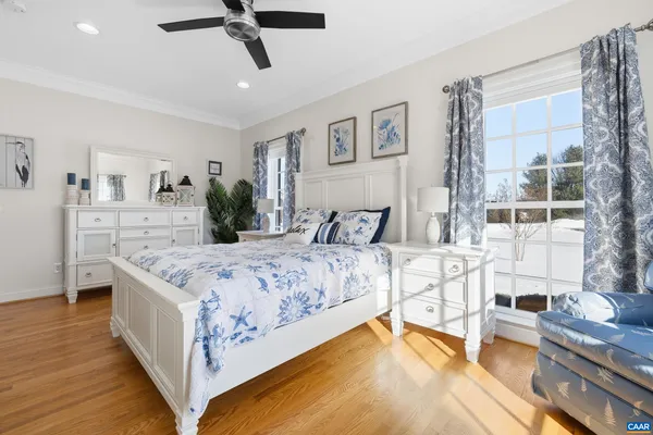 a bathroom with a double vanity sink a toilet and a mirror