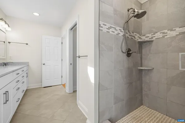 a bedroom with a bed and a tv