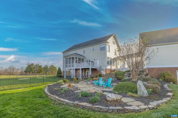 a view of balcony with wooden floor and fence