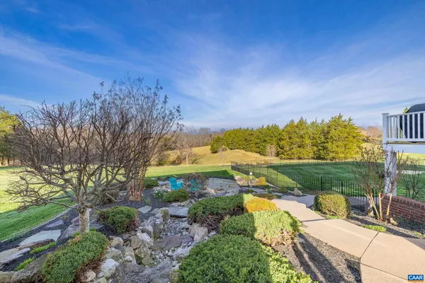 a view of a city with lush green forest