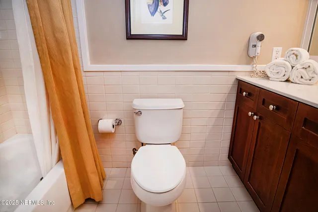 a bathroom with a toilet and a sink