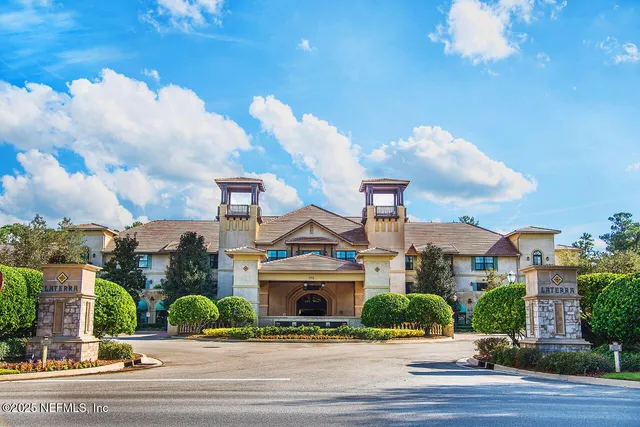 a view of a building and a yard