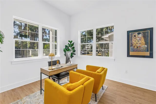 a living room with furniture and windows