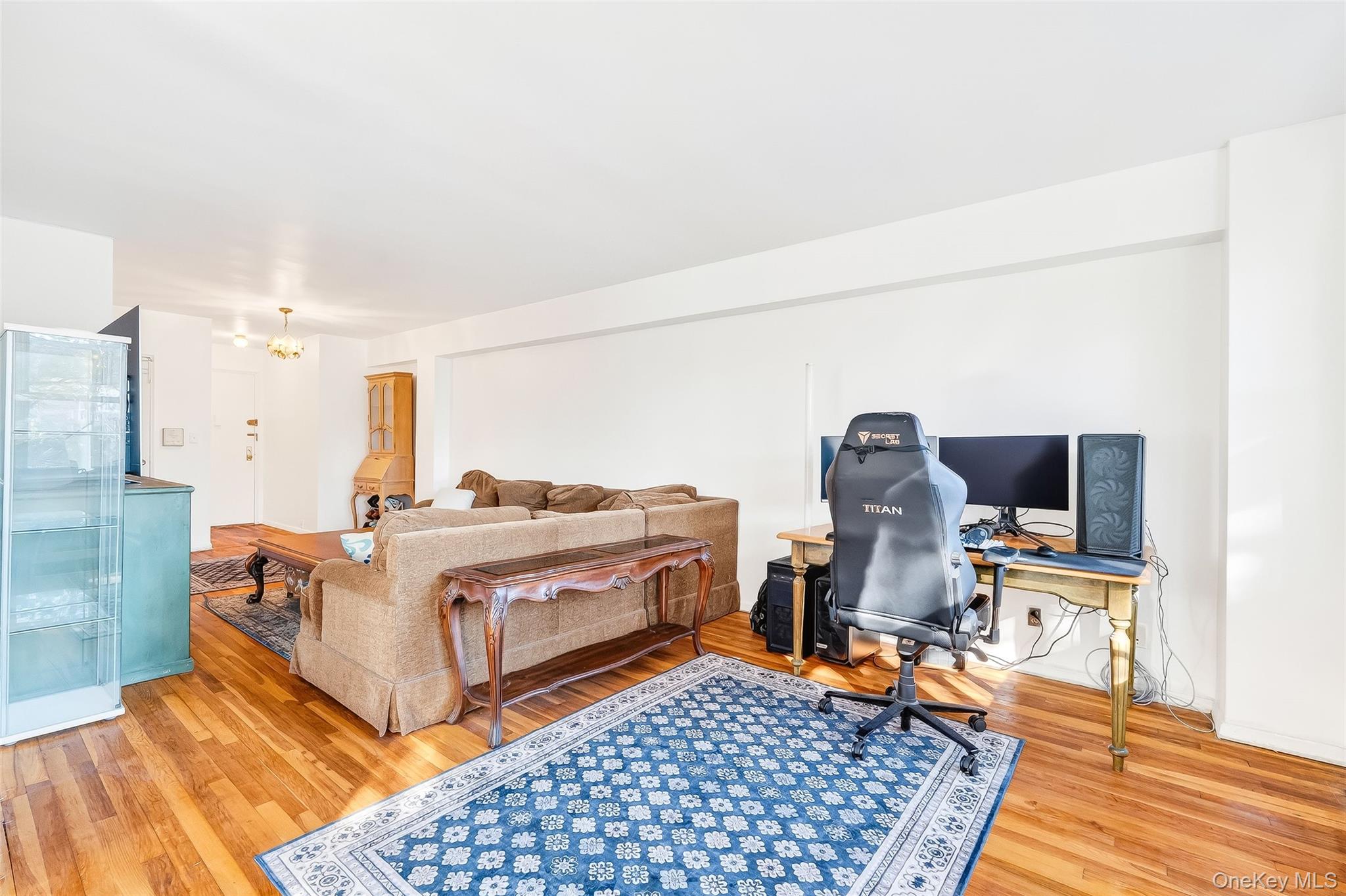 609 Palmer Road, Unit 5L Yonkers, NY 10701 - Photo 14 of 33 a bed room with a bed and a chair