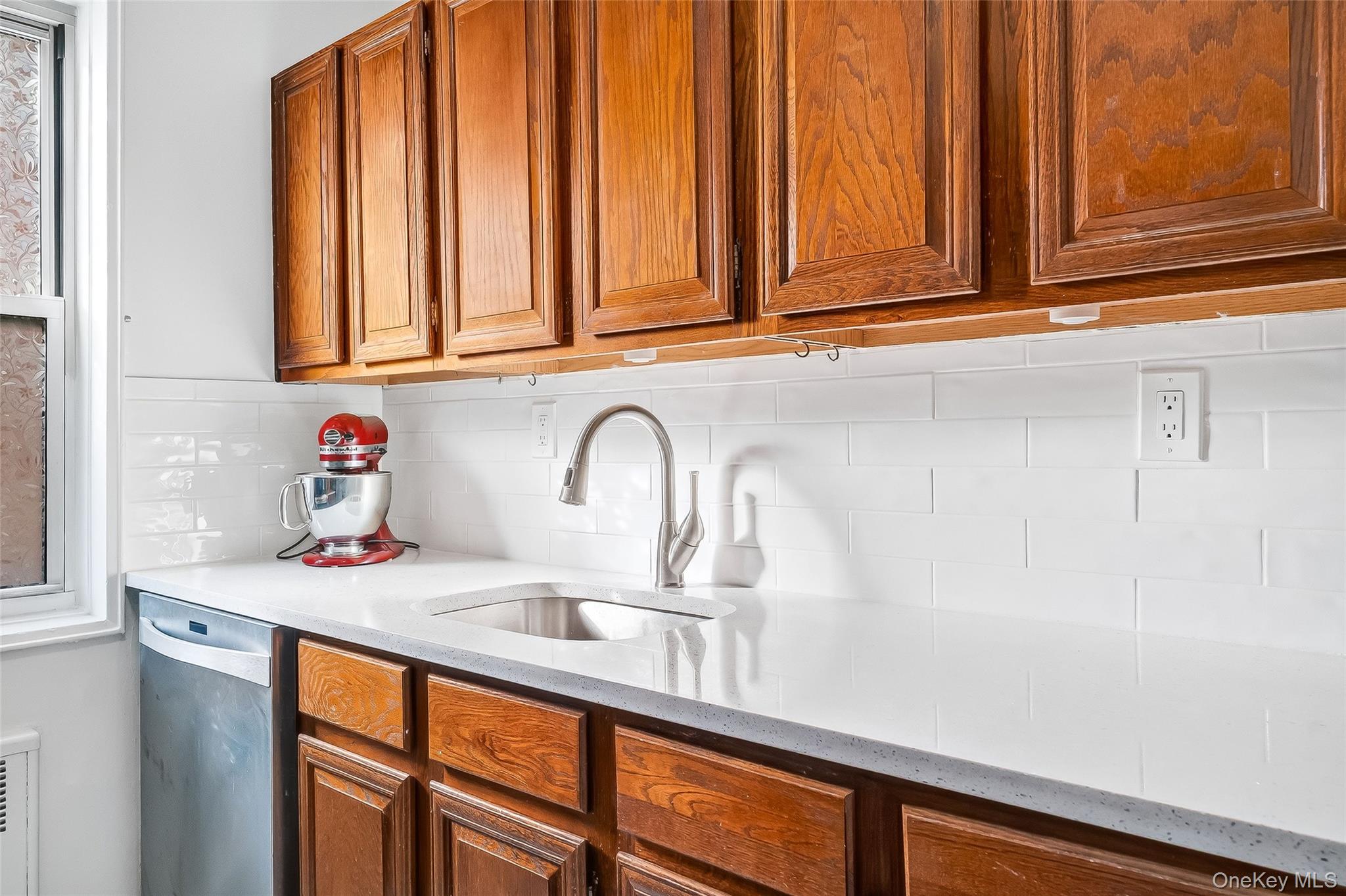 609 Palmer Road, Unit 5L Yonkers, NY 10701 - Photo 8 of 33 a kitchen with stainless steel appliances granite countertop a sink and cabinets