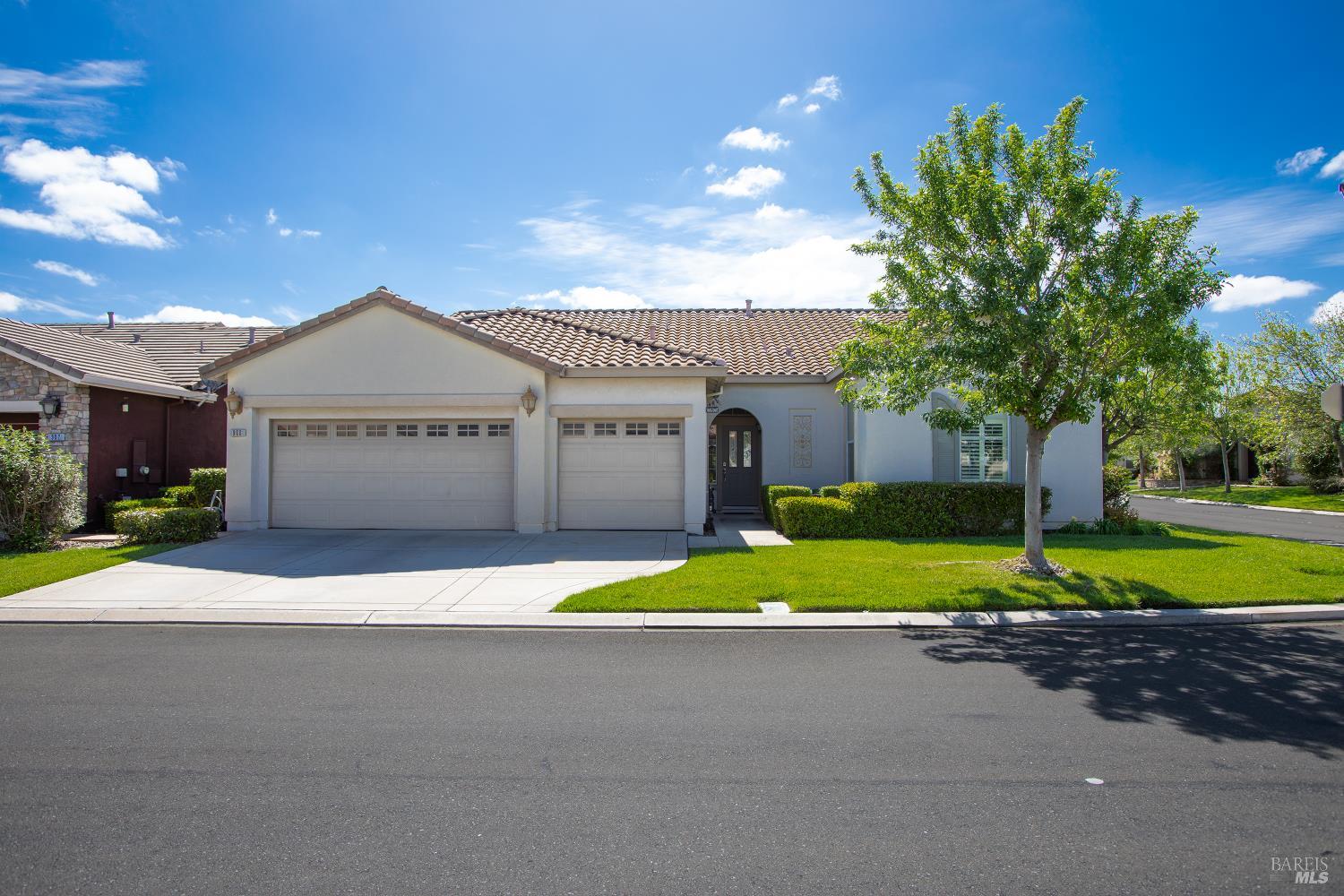900 Livingston Place Rio Vista, CA 94571 - Photo 1 of 38 a front view of a house with a yard and garage