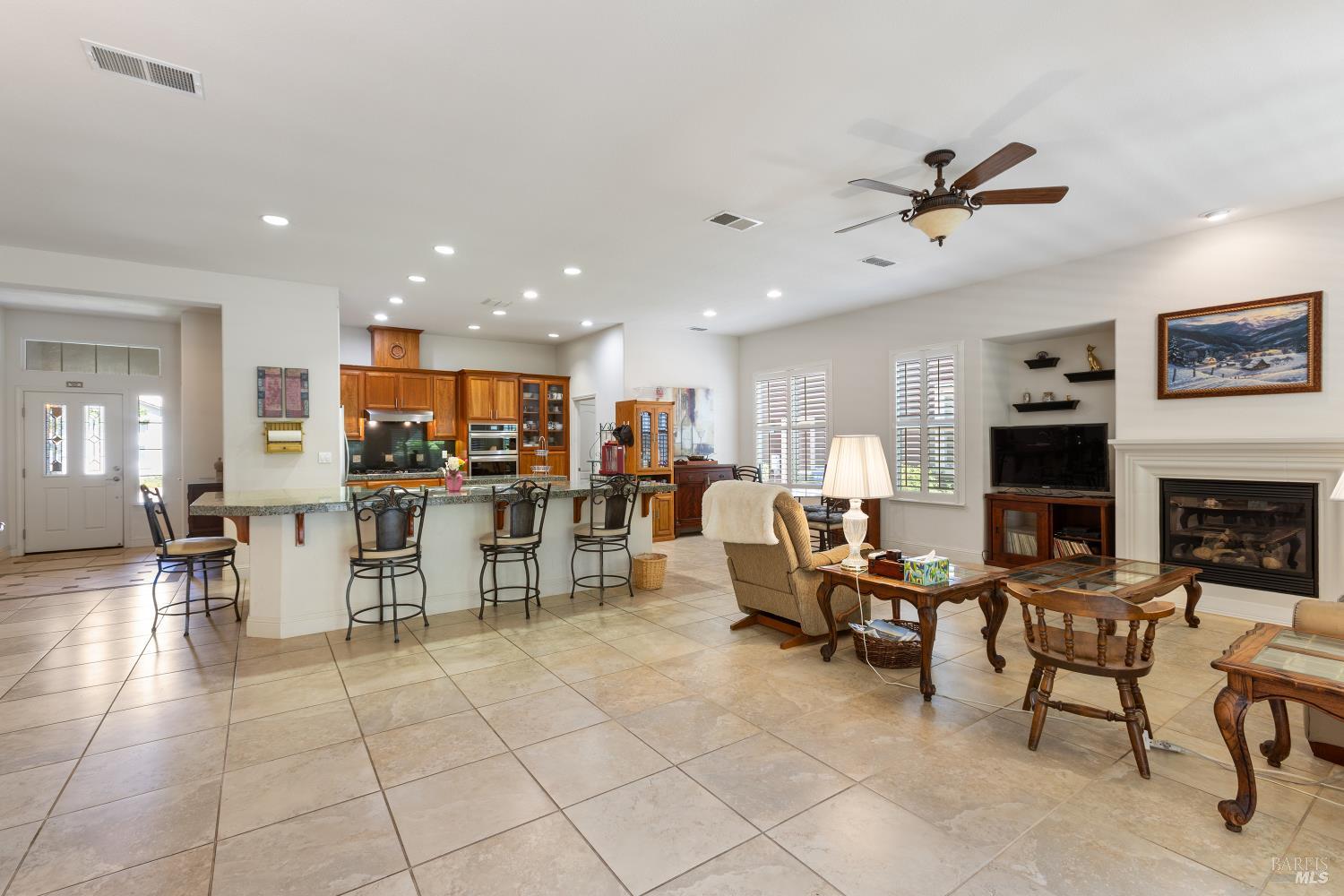 900 Livingston Place Rio Vista, CA 94571 - Photo 11 of 38 a living room with furniture a dining table and kitchen view