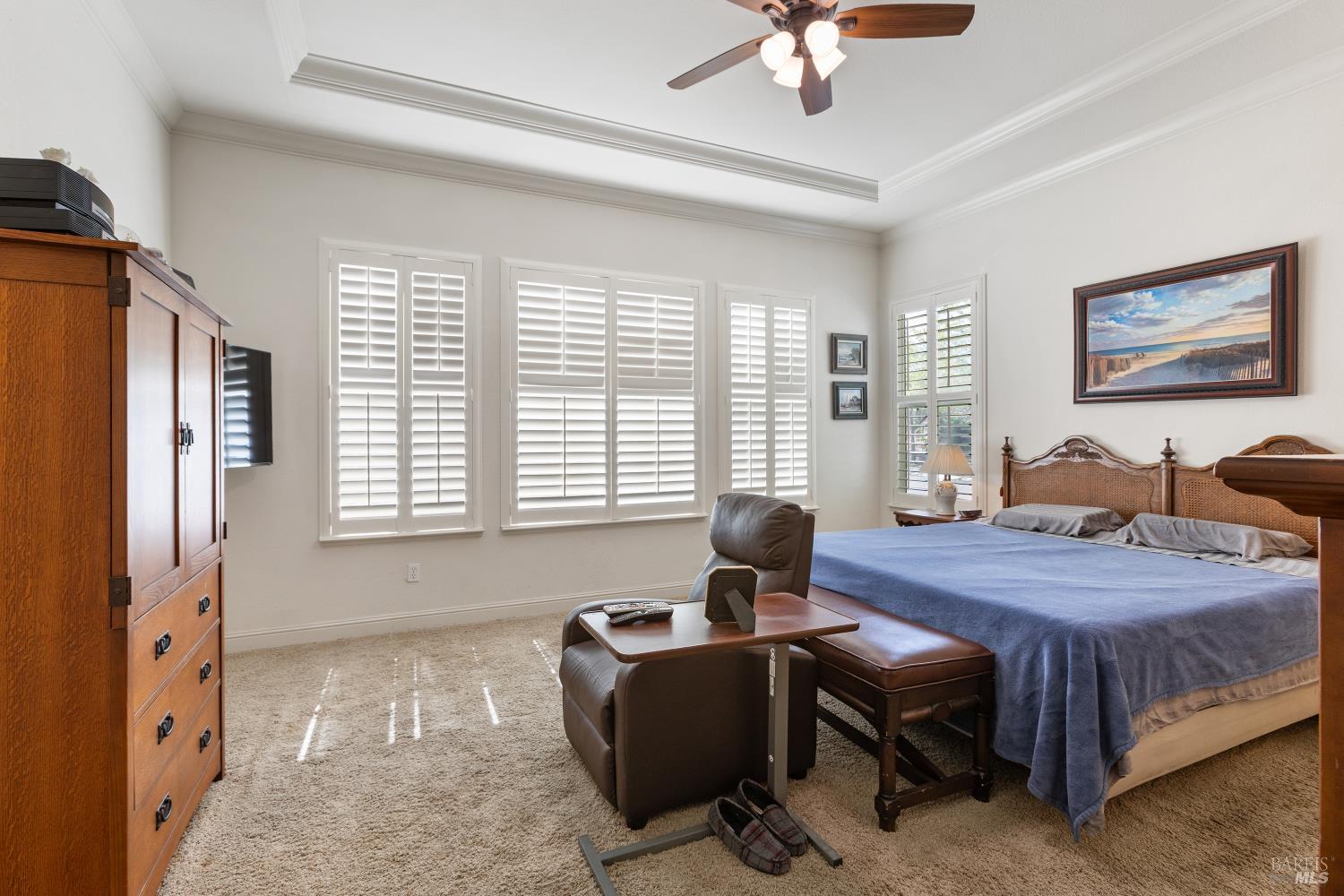 900 Livingston Place Rio Vista, CA 94571 - Photo 24 of 38 a bedroom with a bed and a chandelier