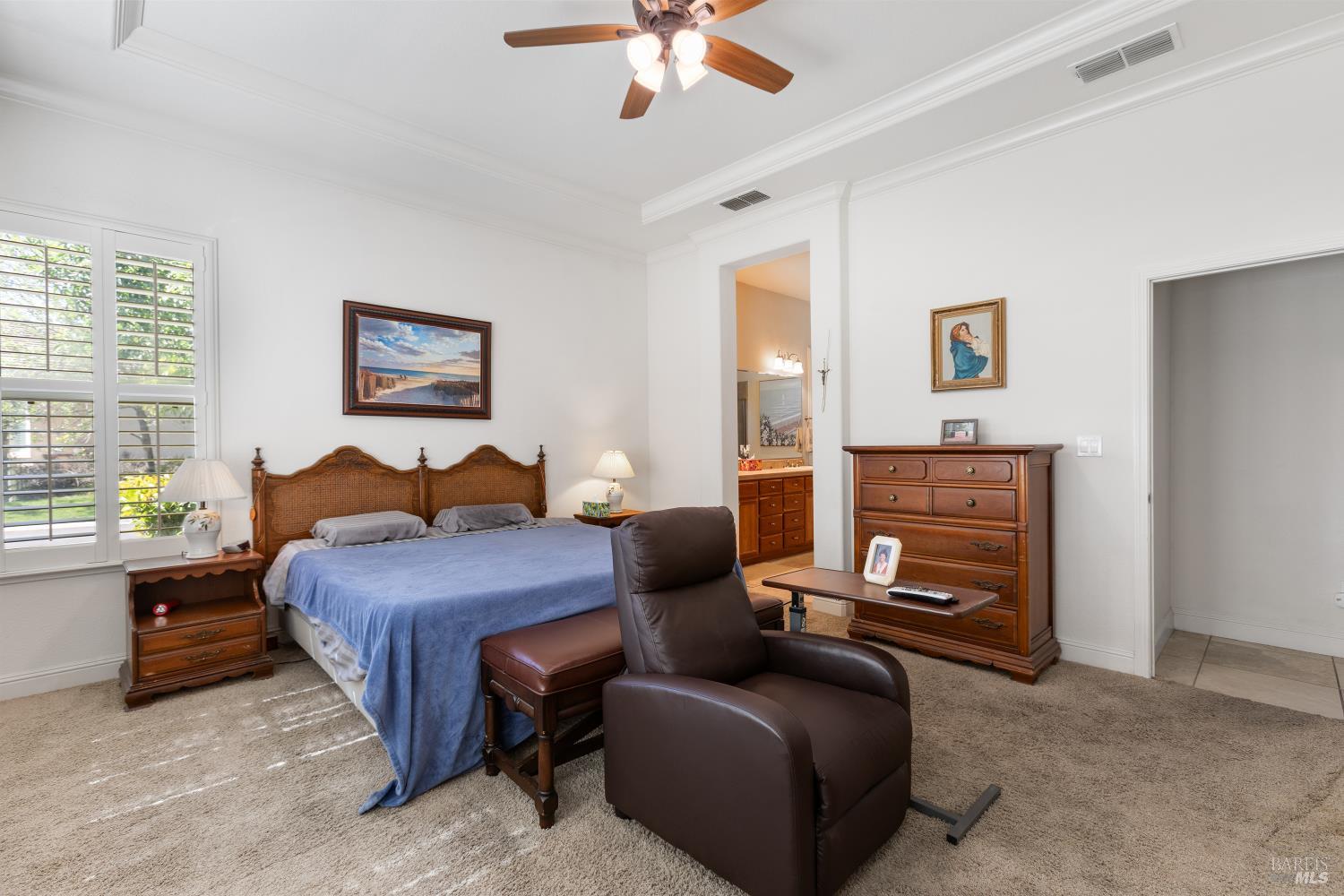 900 Livingston Place Rio Vista, CA 94571 - Photo 25 of 38 a bedroom with a bed couches and a flat tv screen