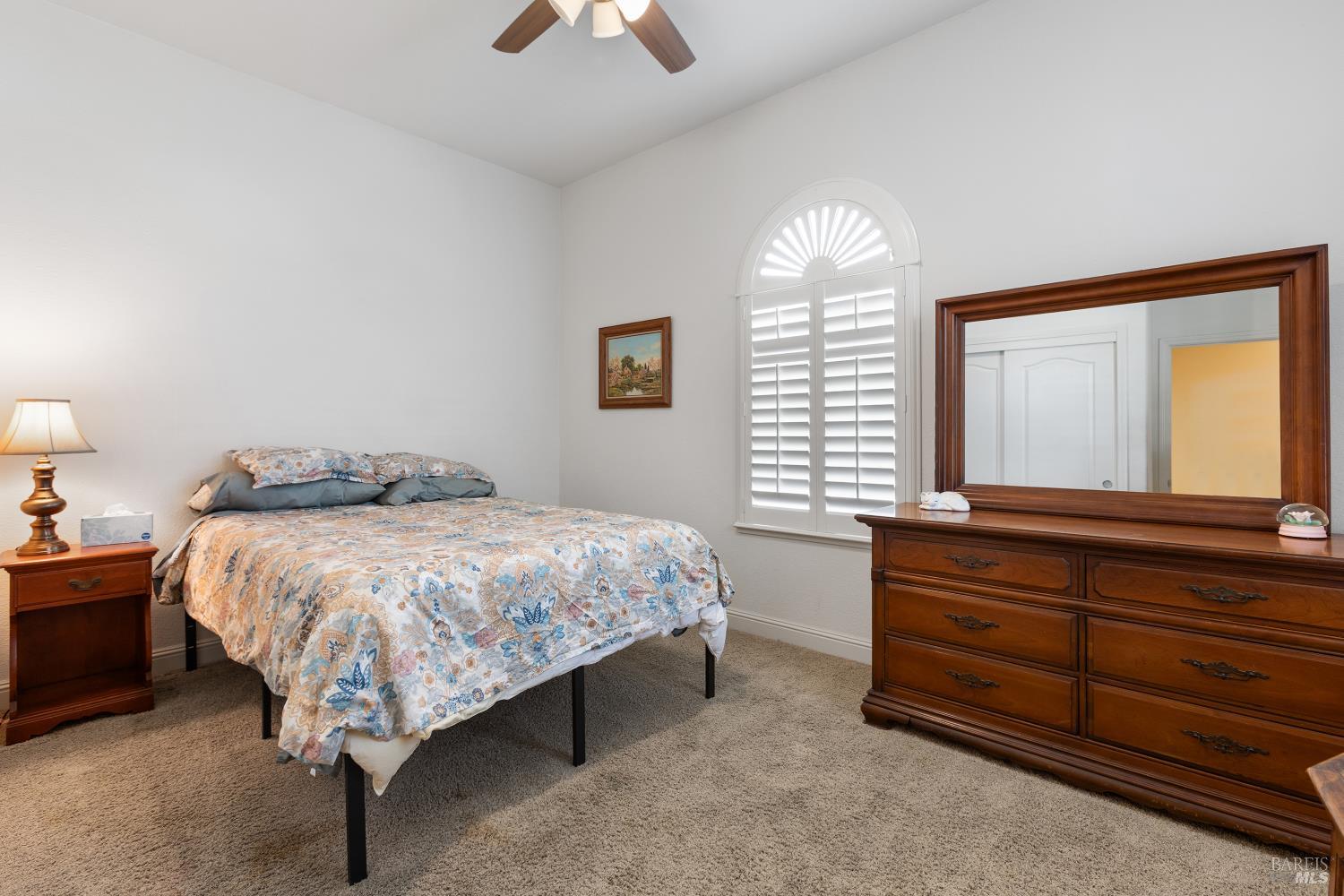 900 Livingston Place Rio Vista, CA 94571 - Photo 32 of 38 a bed room with a bed and a chandelier