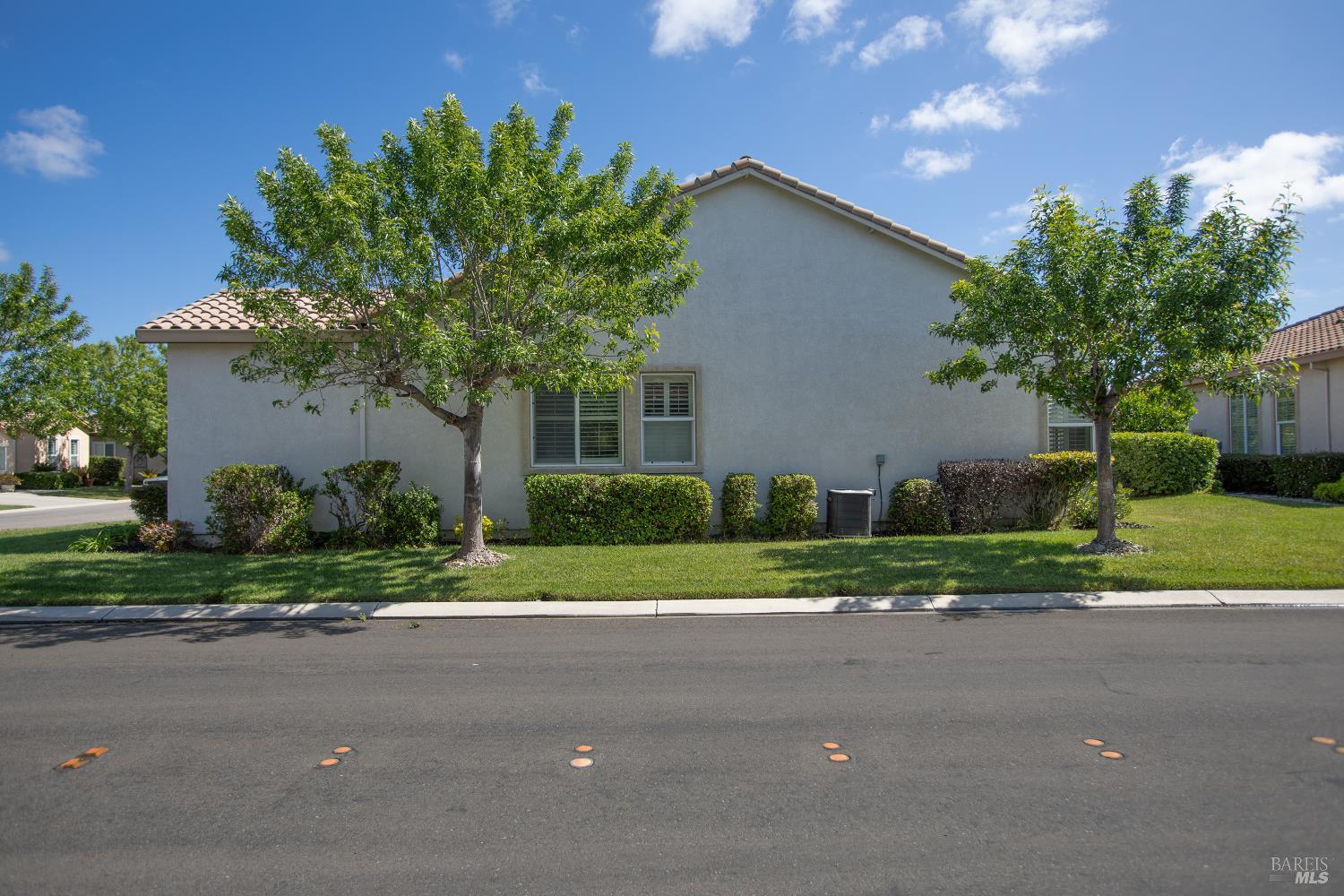 900 Livingston Place Rio Vista, CA 94571 - Photo 6 of 38 a front view of a house with a yard and a garage