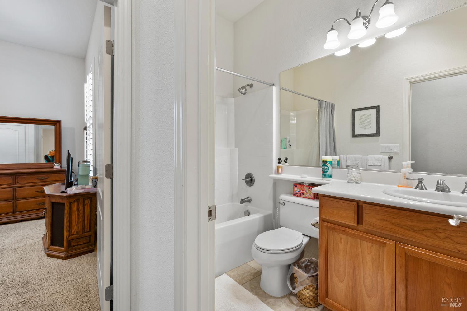 900 Livingston Place Rio Vista, CA 94571 - Photo 8 of 38 a bathroom with a toilet sink and mirror